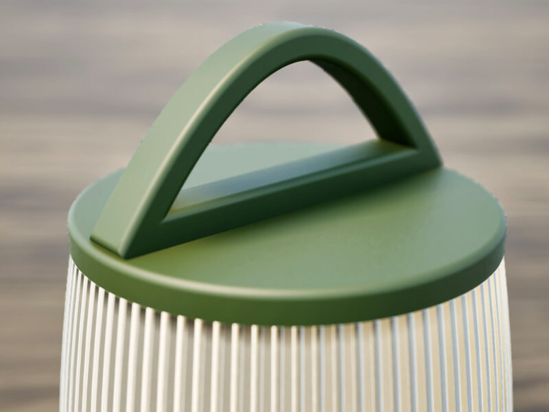 Poignée verte d'une lampe nomade à LED.